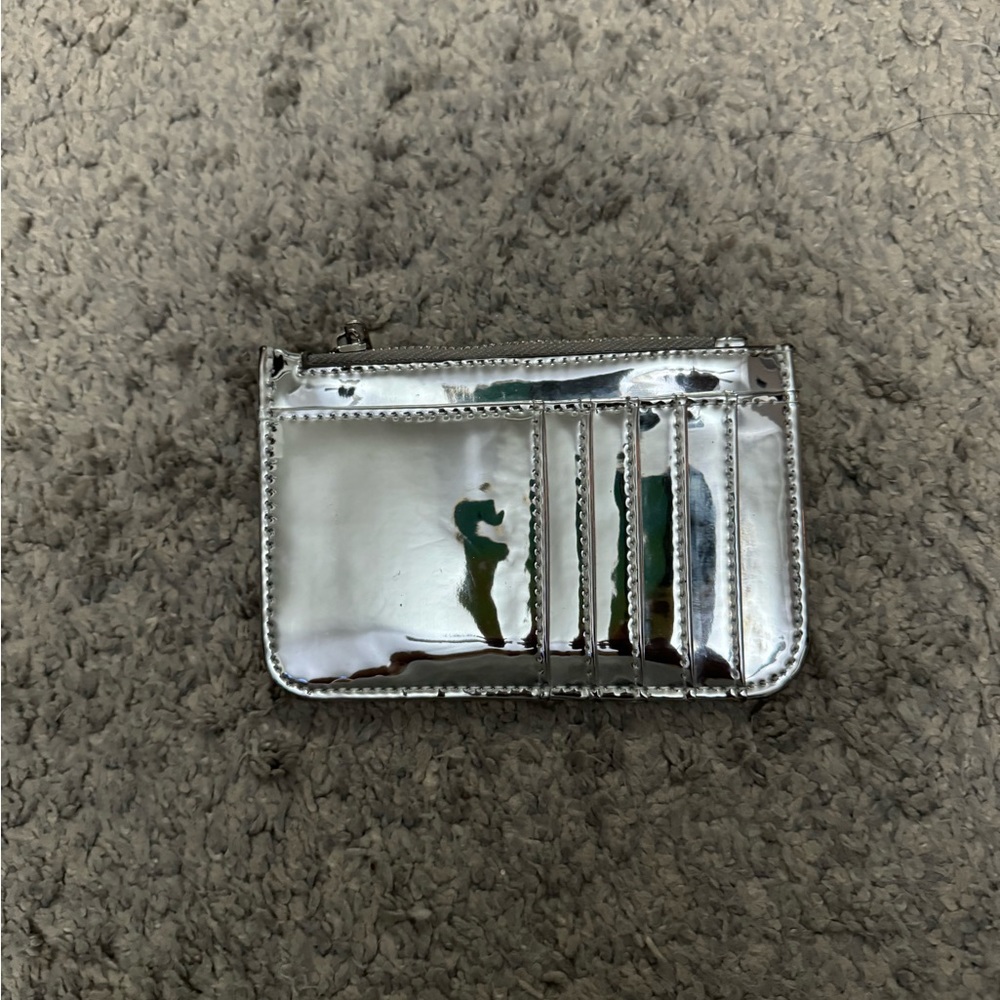 Silver metallic card holder, like new condition, only worn a few times